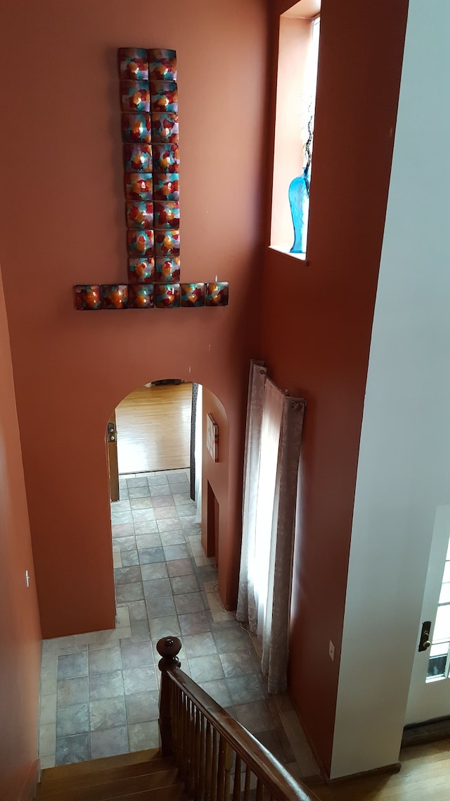 677 Selden St, Detroit, MI 48201 - staircase with arched walkways and stone finish flooring