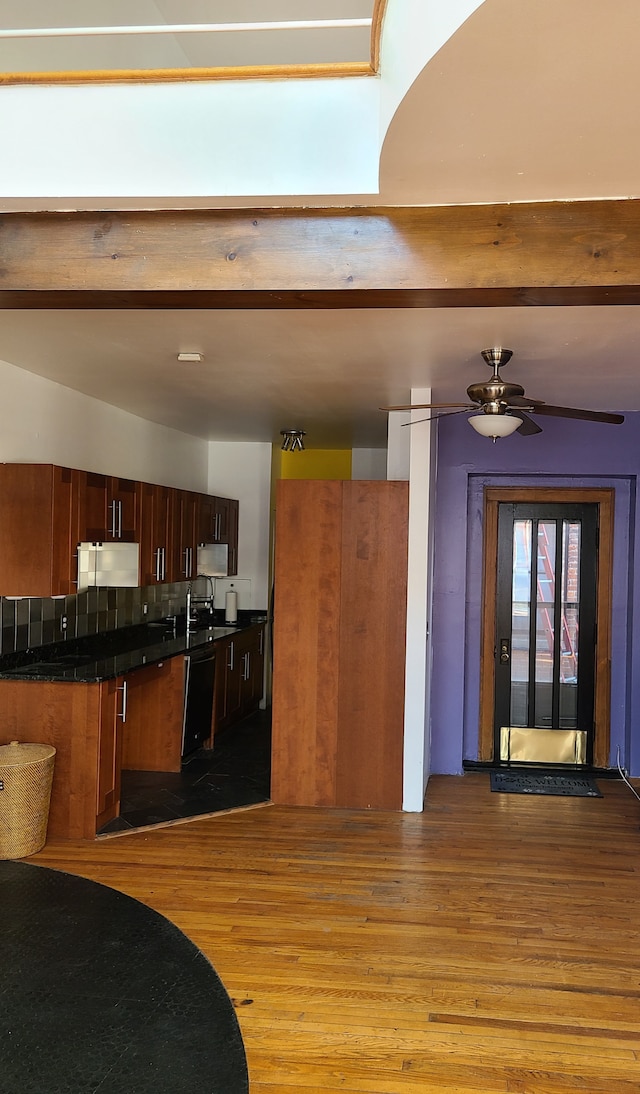 kitchen with dishwasher, ceiling fan, backsplash, and light hardwood / wood-style flooring