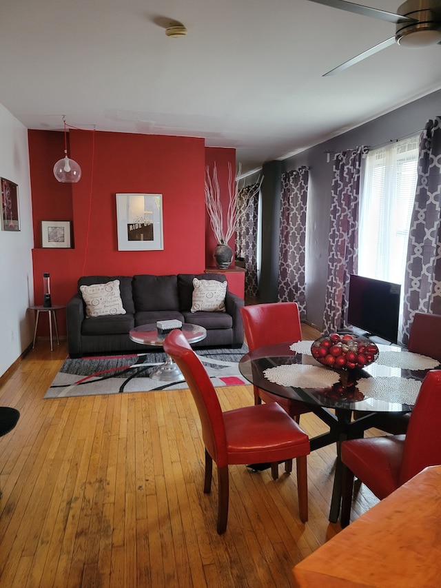 dining space featuring ceiling fan and wood-type flooring