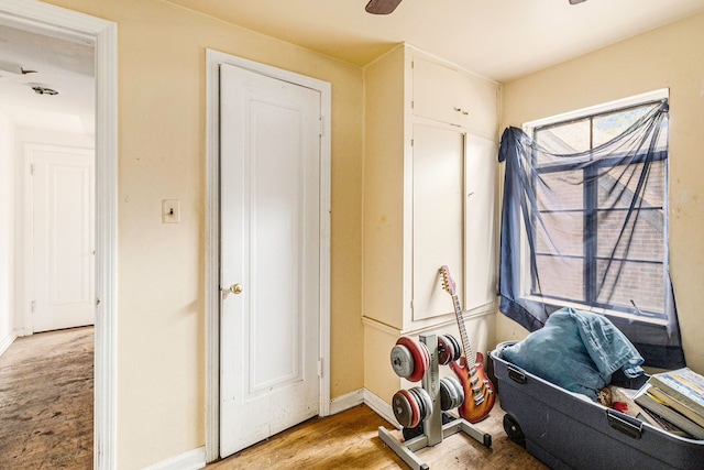 miscellaneous room featuring ceiling fan and light wood-type flooring