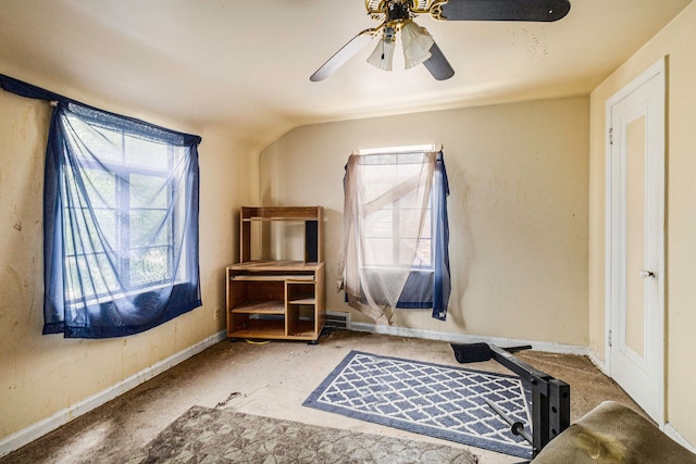 bedroom featuring ceiling fan and lofted ceiling