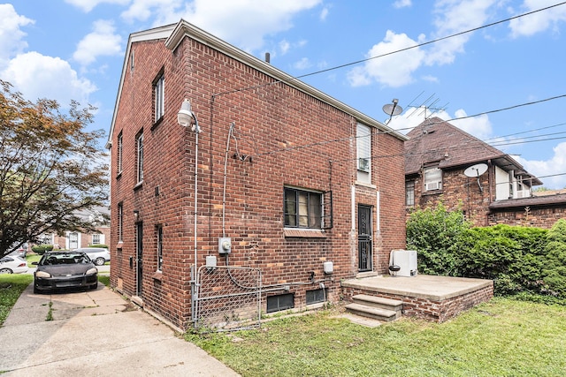 view of side of home featuring a yard