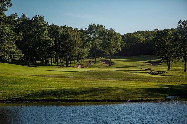 4701 Pinnacle Blvd, Rochester, MI 48306 - view of home's community featuring a water view, view of golf course, a lawn, and view of wooded area