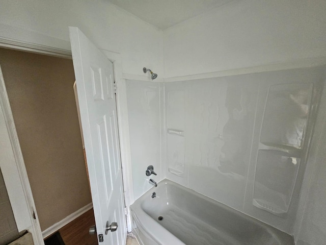 bathroom featuring hardwood / wood-style floors and shower / bathing tub combination