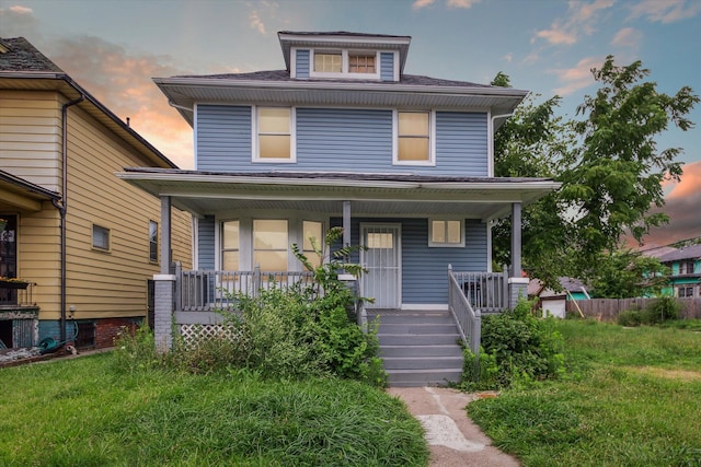 3738 Montgomery Ave, Detroit, MI 48206 - american foursquare style home featuring a porch and roof with shingles