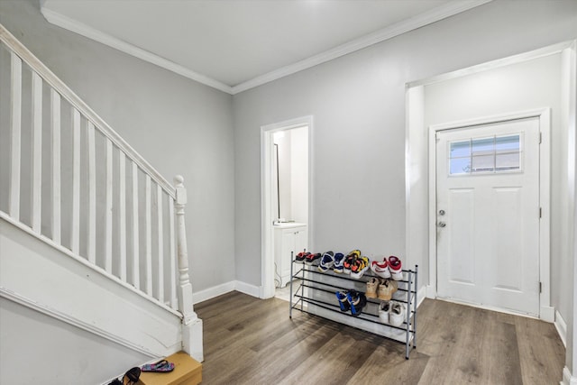 3738 Montgomery Ave, Detroit, MI 48206 - entrance foyer featuring stairs, wood finished floors, crown molding, and baseboards