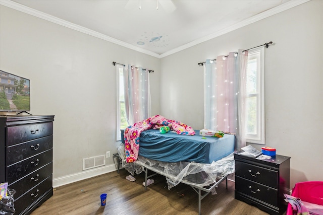 3738 Montgomery Ave, Detroit, MI 48206 - bedroom featuring wood finished floors, multiple windows, ornamental molding, baseboards, and ceiling fan