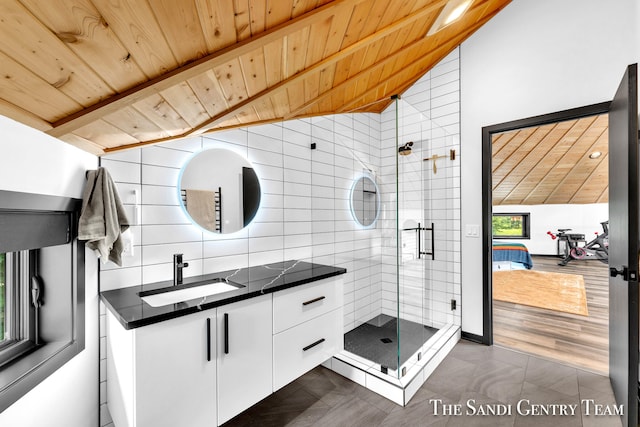 bathroom featuring wood ceiling, vanity, vaulted ceiling, hardwood / wood-style flooring, and a shower with shower door