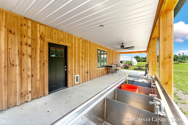 view of patio / terrace featuring ceiling fan