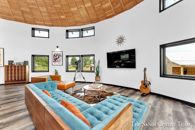 living room featuring high vaulted ceiling, wood ceiling, and hardwood / wood-style flooring