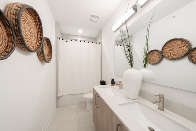 full bathroom with tile patterned floors, vanity, shower / bath combination with curtain, and toilet