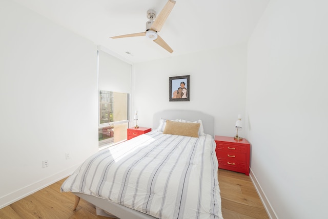 bedroom featuring ceiling fan and light hardwood / wood-style flooring