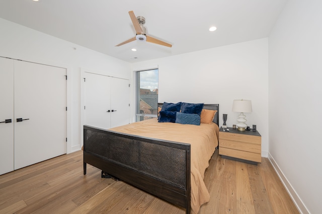 bedroom with ceiling fan and light wood-type flooring