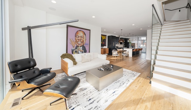 2813 Brush St Unit 99, Detroit, MI 48201 - living room with stairs, light wood finished floors, and recessed lighting