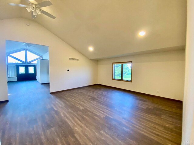 unfurnished room featuring dark hardwood / wood-style flooring, ceiling fan, and lofted ceiling