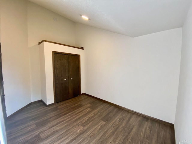 spare room with dark hardwood / wood-style flooring