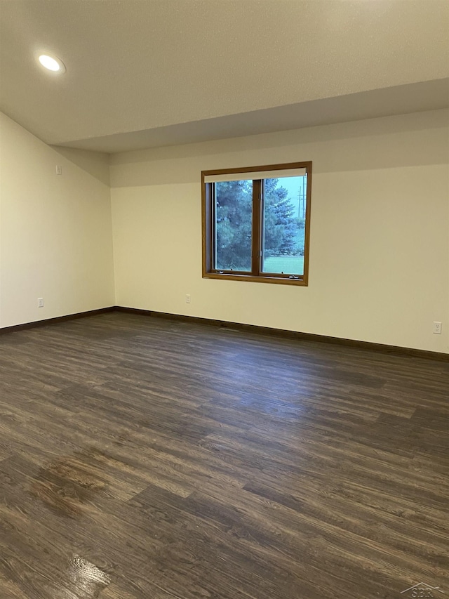 3879 Kochville Rd, Saginaw, MI 48604 - spare room with baseboards, dark wood-style flooring, and recessed lighting
