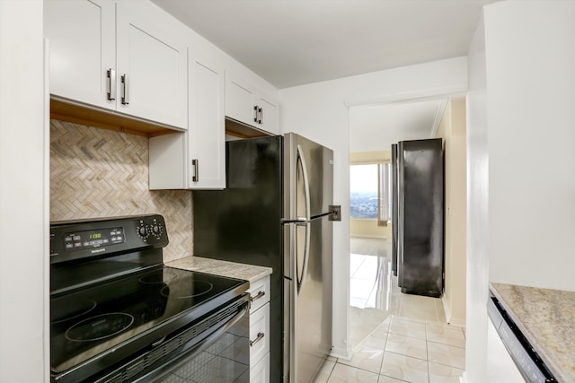 kitchen featuring backsplash, white cabinetry, black electric range oven, and light tile patterned floors