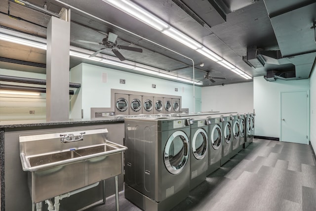 laundry area featuring ceiling fan, independent washer and dryer, and dark wood-type flooring