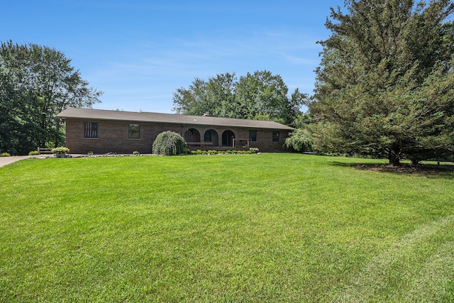 10133 W Allen Rd, Fowlerville, MI 48836 - ranch-style home featuring a front lawn and brick siding