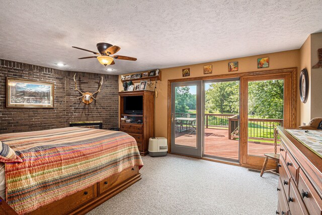 10133 W Allen Rd, Fowlerville, MI 48836 - bedroom with carpet floors, access to exterior, brick wall, and a textured ceiling