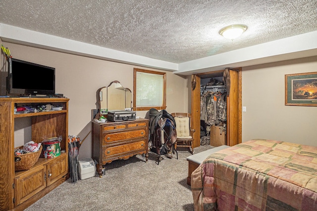 bedroom featuring a textured ceiling, light colored carpet, and a closet