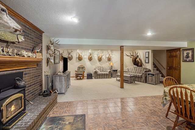10133 W Allen Rd, Fowlerville, MI 48836 - living room with a wood stove, a textured ceiling, carpet flooring, stairway, and brick wall
