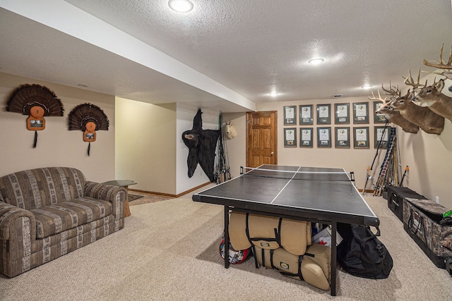 game room with light carpet and a textured ceiling