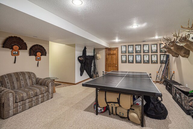 10133 W Allen Rd, Fowlerville, MI 48836 - game room with carpet floors, a textured ceiling, and baseboards