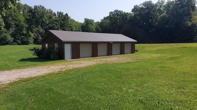 garage featuring a lawn