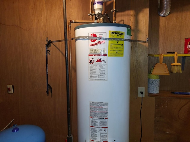 utility room featuring water heater