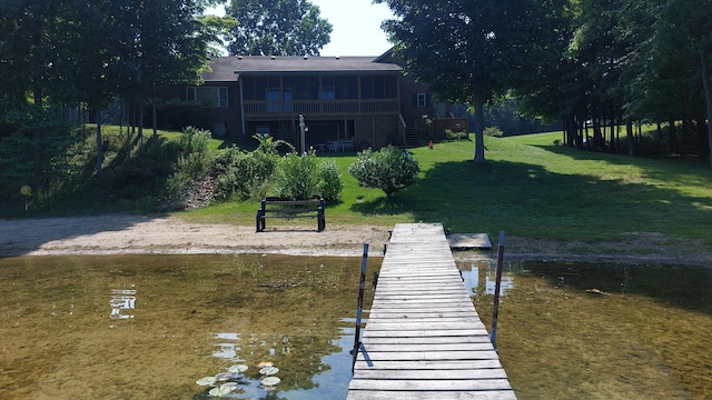 dock area featuring a yard and a water view