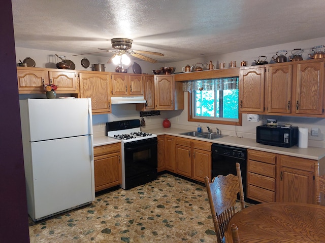 kitchen featuring black appliances, ceiling fan, sink, and a textured ceiling