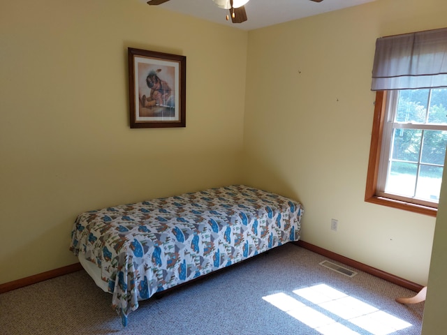 carpeted bedroom with ceiling fan