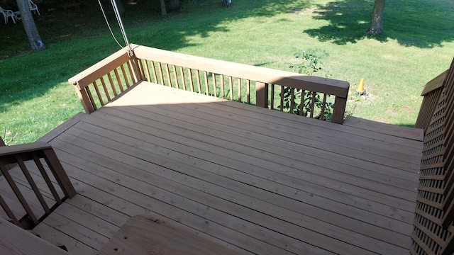 wooden terrace with a lawn