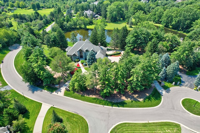 birds eye view of property with a water view