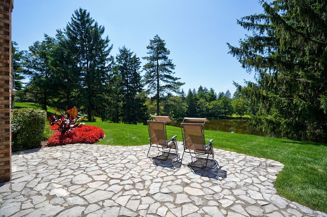 view of patio / terrace featuring a water view