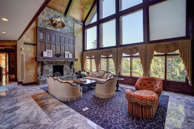 living room with a fireplace and high vaulted ceiling