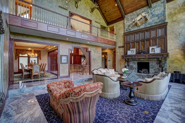 living room featuring high vaulted ceiling, crown molding, a fireplace, a notable chandelier, and wood ceiling