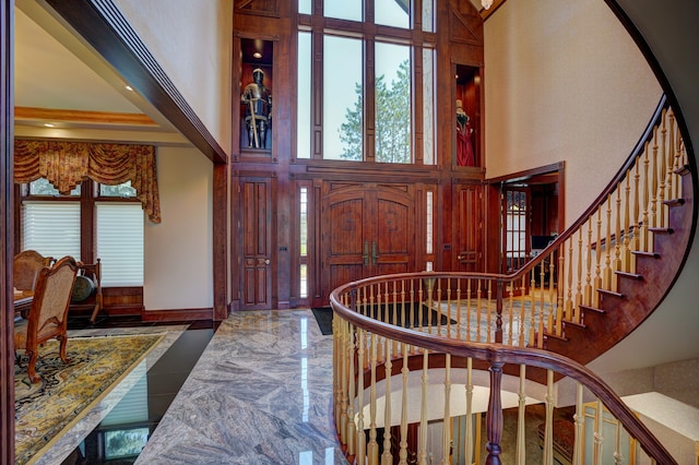 entrance foyer featuring a towering ceiling