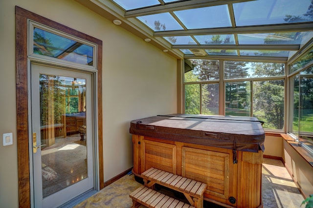 sunroom / solarium with a skylight and a hot tub