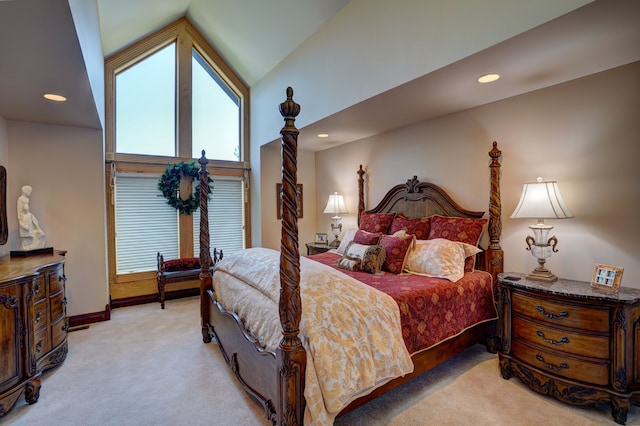 bedroom with light carpet and vaulted ceiling