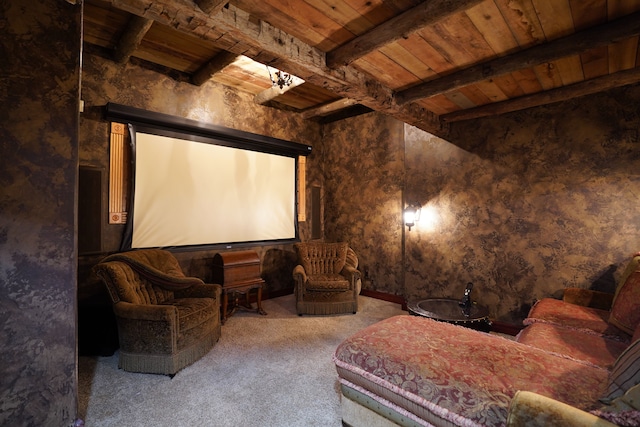 cinema room featuring carpet, beam ceiling, and wooden ceiling