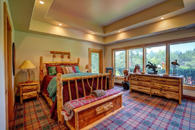 bedroom with a tray ceiling