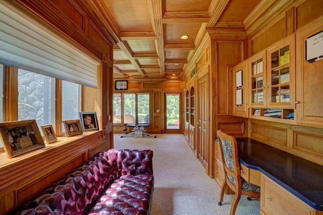 sitting room featuring light carpet, coffered ceiling, wooden walls, wood ceiling, and ornamental molding