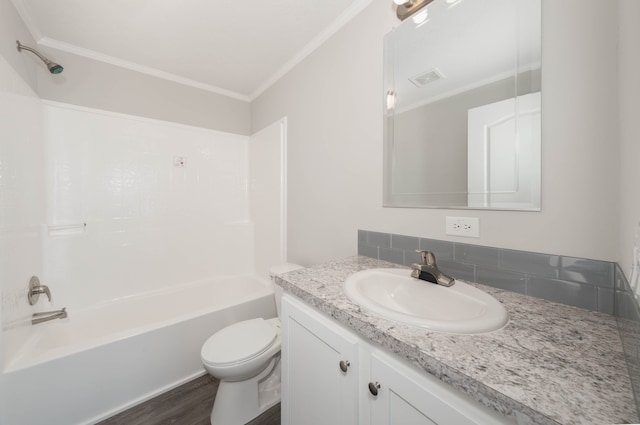 2776 Pinellas Ct, Lapeer, MI 48446 - bathroom with vanity, toilet, crown molding, shower / bathtub combination, and decorative backsplash