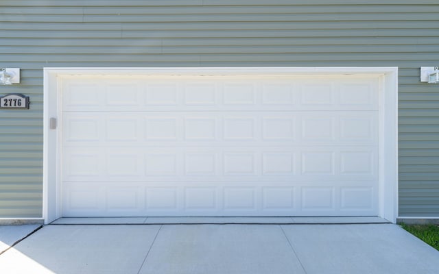 2776 Pinellas Ct, Lapeer, MI 48446 - garage featuring concrete driveway