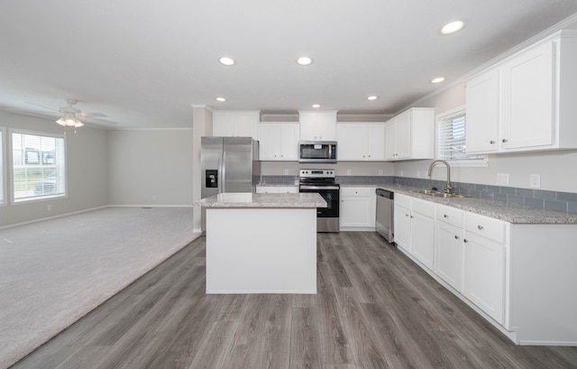 2776 Pinellas Ct, Lapeer, MI 48446 - kitchen with stainless steel appliances, a sink, plenty of natural light, recessed lighting, and baseboards