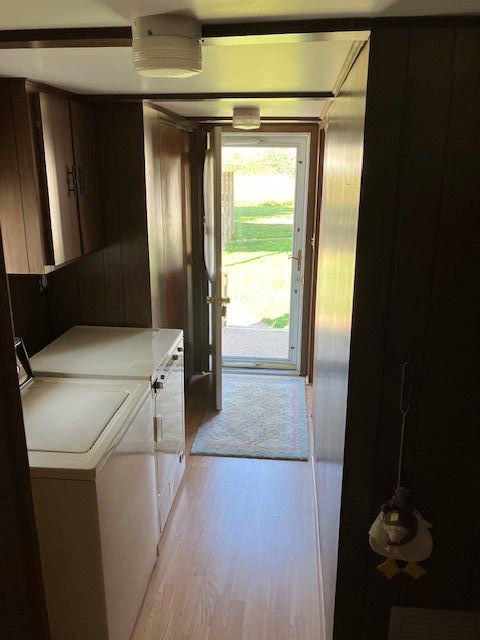 7377 Birch Dr, Port Hope, MI 48468 - laundry area with washer and dryer and light wood finished floors