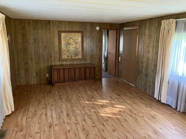 7377 Birch Dr, Port Hope, MI 48468 - empty room featuring wood finished floors and wood walls